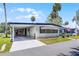 Welcoming single-story home with covered parking and charming curb appeal at 200 Palm Meadows Dr, Eustis, FL 32726