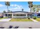 Charming single-story home with a well-maintained lawn and covered parking at 200 Palm Meadows Dr, Eustis, FL 32726