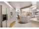 Traditional white kitchen with white appliances, cabinets, and countertops, plus vintage floral wallpaper border at 200 Palm Meadows Dr, Eustis, FL 32726