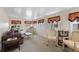 Comfortable sun room with multiple windows providing great natural light and cozy furniture at 200 Palm Meadows Dr, Eustis, FL 32726