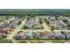 Expansive aerial view of a residential neighborhood featuring well-maintained homes and lush greenery at 204 Bay Meadow Dr, Kissimmee, FL 34746