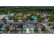 Charming home with neat lawn adjacent to a vibrant entertainment area with colorful buildings and attractions at 204 Bay Meadow Dr, Kissimmee, FL 34746