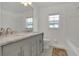 Bright bathroom with double sink vanity, marble countertop, and lots of natural light at 204 Bay Meadow Dr, Kissimmee, FL 34746