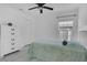 Bedroom featuring tile floors, ceiling fan, and window at 204 Bay Meadow Dr, Kissimmee, FL 34746