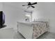 Bedroom featuring tile floors, ceiling fan, and window at 204 Bay Meadow Dr, Kissimmee, FL 34746