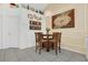 Cozy dining area features a chandelier, decorative wall art, and a round wooden table with four chairs at 204 Bay Meadow Dr, Kissimmee, FL 34746