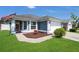 Attractive home featuring a two-car garage, neat landscaping, and a charming American flag display at 204 Bay Meadow Dr, Kissimmee, FL 34746