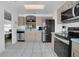 Bright kitchen features stainless steel appliances, tile floors, and a lovely pass through at 204 Bay Meadow Dr, Kissimmee, FL 34746