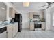 Functional kitchen includes modern appliances, ample cabinet space, and durable tile flooring at 204 Bay Meadow Dr, Kissimmee, FL 34746
