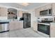 Bright kitchen features stainless steel appliances, tile floors, and a lovely pass through at 204 Bay Meadow Dr, Kissimmee, FL 34746