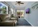 Comfortable living room with cozy seating, slider to outside patio, and a ceiling fan at 204 Bay Meadow Dr, Kissimmee, FL 34746