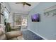 Comfortable living room with cozy seating, slider to outside patio, and a ceiling fan at 204 Bay Meadow Dr, Kissimmee, FL 34746
