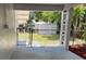 Covered back porch featuring a view of the fenced backyard and storage shed at 205 Brighton Way, Casselberry, FL 32707