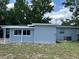 Exterior view of the home highlighting the backyard space and architectural details at 205 Brighton Way, Casselberry, FL 32707