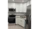 Well-equipped kitchen with stainless steel appliances, granite countertops and ample cabinet space at 205 Brighton Way, Casselberry, FL 32707