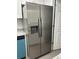 Modern kitchen featuring a stainless steel, side-by-side Frigidaire refrigerator with a built-in water dispenser at 205 Brighton Way, Casselberry, FL 32707