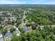An aerial view showcasing the home, neighborhood, and proximity to local bodies of water at 2106 Tuscarora Trl, Maitland, FL 32751
