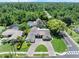 Expansive aerial view of this home with brick driveway on a treelined street at 2106 Tuscarora Trl, Maitland, FL 32751