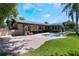 Beautiful backyard with a pool, lush lawn, mature landscaping, and brick-paved patio area at 2106 Tuscarora Trl, Maitland, FL 32751