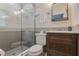 Modern bathroom featuring a glass enclosed shower and a dark wood vanity at 2106 Tuscarora Trl, Maitland, FL 32751
