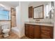 Well-lit bathroom features an elegant vanity, shower-tub combo, and tile accents at 2106 Tuscarora Trl, Maitland, FL 32751