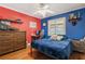 Vibrant bedroom with hardwood floors and a ceiling fan at 2106 Tuscarora Trl, Maitland, FL 32751