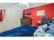 Bedroom with hardwood floors, a large window, and ample closet space at 2106 Tuscarora Trl, Maitland, FL 32751