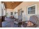 Charming front porch with seating, brick flooring, and overhead wood ceiling at 2106 Tuscarora Trl, Maitland, FL 32751