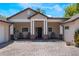 Inviting front porch with brickwork, seating area, and stylish entrance at 2106 Tuscarora Trl, Maitland, FL 32751