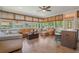 Sunroom living area with leather furniture and many windows at 2106 Tuscarora Trl, Maitland, FL 32751