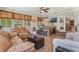 Spacious sunroom has tile floors and seating for entertaining at 2106 Tuscarora Trl, Maitland, FL 32751