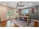 Home office with hardwood floors, ceiling fan, and french doors to the patio at 2106 Tuscarora Trl, Maitland, FL 32751