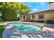 Beautiful pool and patio area surrounded by lush landscaping and a well-manicured lawn at 2106 Tuscarora Trl, Maitland, FL 32751