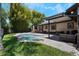 Beautiful backyard showing a pool, stone paved patio, lawn, and a house at 2106 Tuscarora Trl, Maitland, FL 32751