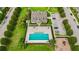 Community aerial view highlights a swimming pool, lounge chairs, landscaping, and playground, perfect for recreation at 2125 Shackley Pl, Apopka, FL 32703