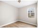 Bedroom with light walls, wood floors, and bright window at 2125 Shackley Pl, Apopka, FL 32703