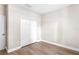 A simple, clean bedroom with wooden floor and closet at 2125 Shackley Pl, Apopka, FL 32703