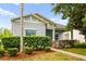 Well-maintained single-story home featuring a landscaped front yard, a combination of stone, and neutral exterior paint at 2125 Shackley Pl, Apopka, FL 32703
