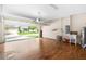 Spacious garage with wooden floors, sink, laundry, storage shelving and abundant natural light at 2125 Shackley Pl, Apopka, FL 32703
