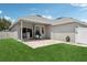 Backyard with patio, grill, privacy fence and well-maintained lawn at 2215 Guiana Plum Dr, Orlando, FL 32828