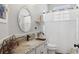 Bathroom with granite countertop, mosaic tile backsplash, and an oval mirror at 2215 Guiana Plum Dr, Orlando, FL 32828