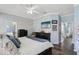 Charming bedroom with dark wood floors, blue walls, and a ceiling fan at 2215 Guiana Plum Dr, Orlando, FL 32828