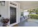 Comfortable front porch with seating area, perfect for relaxing outdoors at 2215 Guiana Plum Dr, Orlando, FL 32828