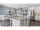 Open kitchen with granite counters, stainless appliances, and an eat-in dining area at 2215 Guiana Plum Dr, Orlando, FL 32828