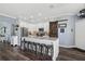 Modern kitchen with white cabinets, granite countertops, and a large center island with seating at 2215 Guiana Plum Dr, Orlando, FL 32828