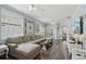 Spacious living room featuring dark wood floors, neutral decor, and lots of natural light at 2215 Guiana Plum Dr, Orlando, FL 32828
