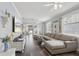 Bright and airy living room with large sectional sofa and elegant decorative touches at 2215 Guiana Plum Dr, Orlando, FL 32828