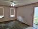 Bright living room with a ceiling fan and access to the outside at 2320 Pebble Brook Rd, Kissimmee, FL 34741