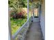 View of the side porch, showcasing the yard, fence, and exterior entrance at 2320 Pebble Brook Rd, Kissimmee, FL 34741