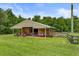 Well-maintained barn with ample open space, covered area, and adjacent paddock for livestock at 2326 Florida Ave, Oviedo, FL 32765
